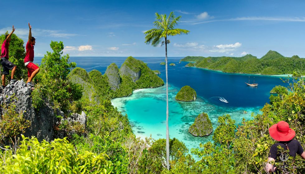 Silolona phinisi at Raja Ampat people view beach from the top